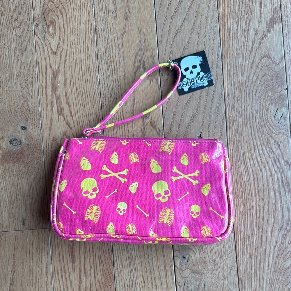 Sourpuss Pink Wristlet Clutch with Neon Yellow Skull Print